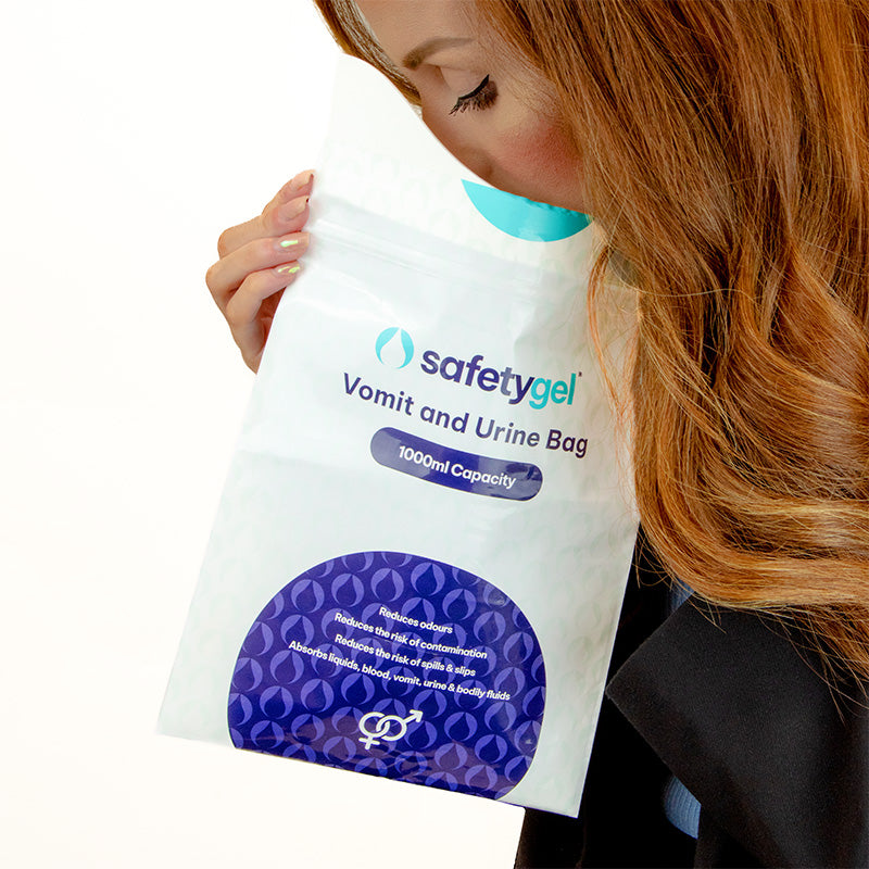 Woman Showing Usage of Vomit and Urine Bag